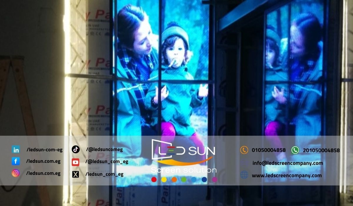 Installing LED Screens at Cairo Festival City Technicians installing LED screens at Cairo Festival City for enhanced digital displays.