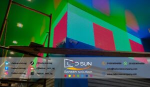 Technicians installing modern LED display screens at ELARABY Group's Makram Ebeid branch.